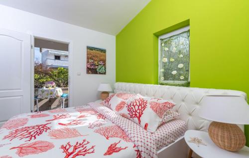 a bedroom with a bed and a green wall at Luxury New !!! Apartment One and Only with terrace & free bikes in Poreč