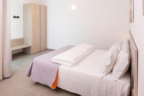 Postel nebo postele na pokoji v ubytování Corte Rocchetti Suite