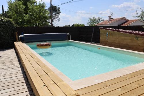 a swimming pool with a ball in the water at la souquette in Draguignan