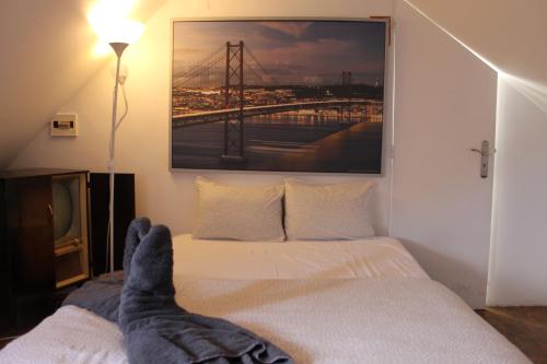 a person with their feet up on a bed at Party Zone in Lisbon
