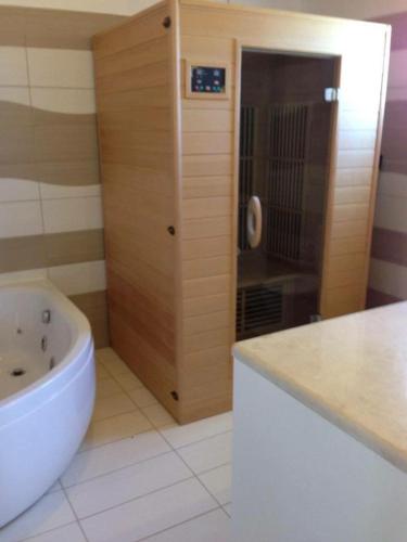 a bathroom with a sink and a bath tub at SAN GEORGE COVE in Afionas