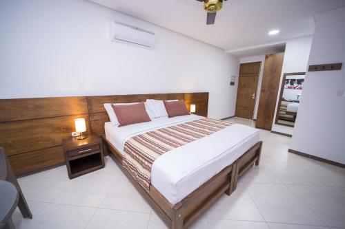 מיטה או מיטות בחדר ב-Hotel Ribera Sinu
