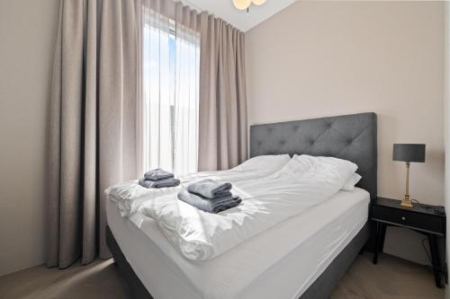 Postel nebo postele na pokoji v ubytování T23 Penthouse Suite - Reykjavík