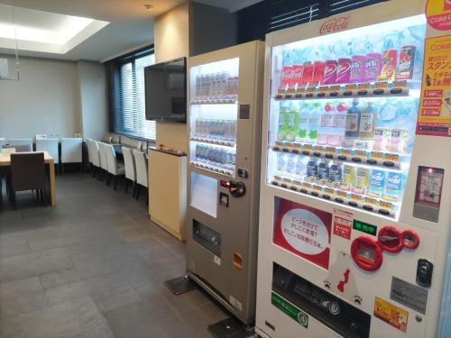 
a room with a lot of different types of refrigerators at Sotetsu Fresa Inn Nihombashi-Ningyocho in Tokyo
