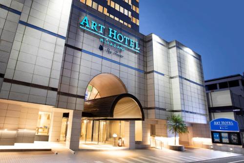 an art hotel with a sign on the front of it at ART HOTEL Miyazaki Sky Tower in Miyazaki