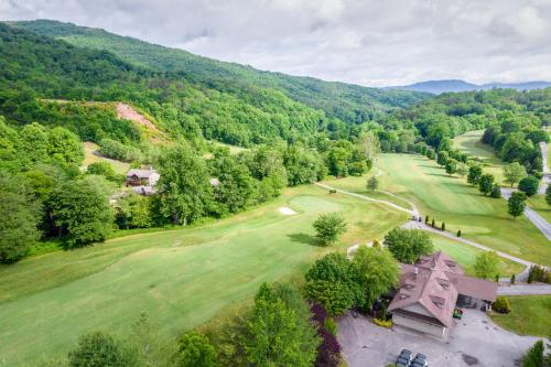 an aerial view of a golf course in the mountains at Altitude with Gratitude in Whittier