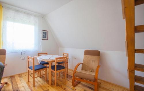 a dining room with a table and chairs at Amazing Home In Opatovac With Wifi in Opatovac