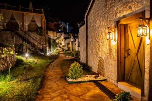 an alley with a building and a door at night at Vista Del Amor Faralya in Fethiye