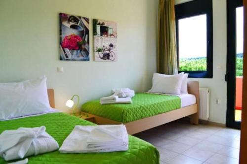 Postel nebo postele na pokoji v ubytování Belle Verte Villa Maleme