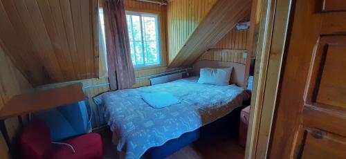 En eller flere senge i et værelse på Casa Cristina_ Cabana