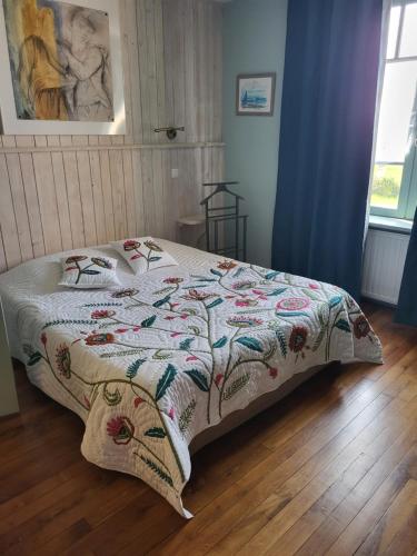 Postelja oz. postelje v sobi nastanitve Maison d'hôtes La Tuilerie
