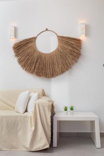 a bedroom with a bed with a mirror and a table at Katerina mare in Naousa