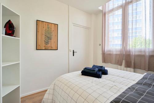 En eller flere senge i et værelse på LocationsTourcoing - Le Carlier