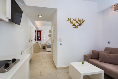 a living room with a couch and a table at Katerina mare in Naousa