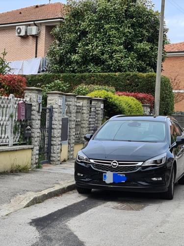 a black car parked in front of a house at Memories B&B in Ferrara