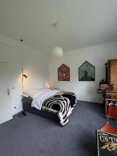 a bedroom with a zebra bed in a room at Villa V - zwischen Kultur und Natur in Viersen