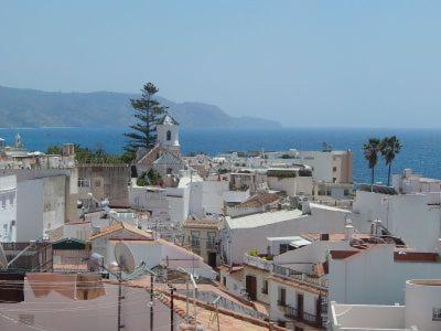 a view of a city with buildings and the ocean at Casablanca in Nerja