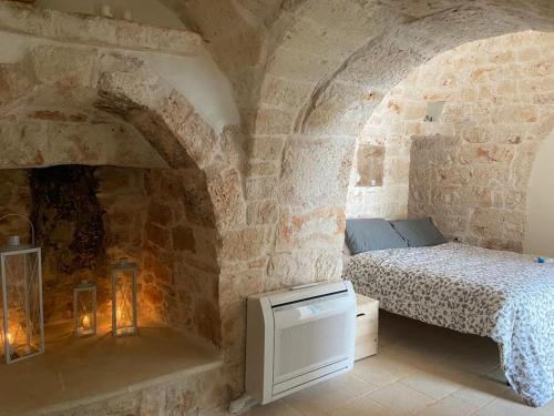 Postel nebo postele na pokoji v ubytování Trulli di Charme Eutuxia