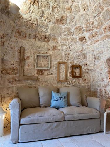 Posezení v ubytování Trulli di Charme Eutuxia