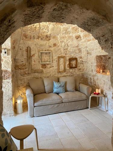 Posezení v ubytování Trulli di Charme Eutuxia