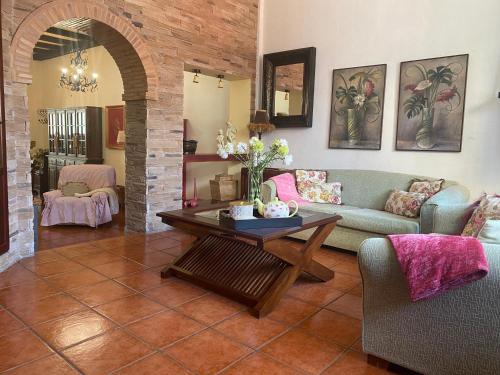 a living room with a couch and a table at LOFT RURAL in Tegueste