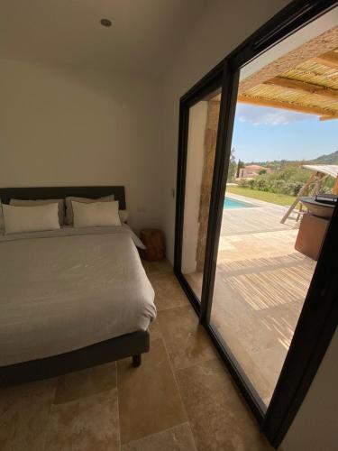 Postel nebo postele na pokoji v ubytování Villa de charme avec piscine à Ajaccio