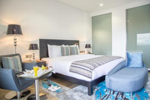 Una cama o camas en una habitación de Amaryllis Hotel Blantyre
