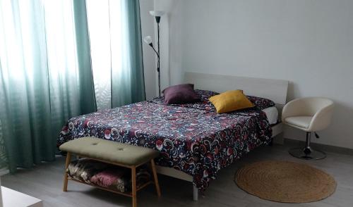 a bedroom with a bed with a table and a chair at Casa Da Frida in San Giovanni in Persiceto