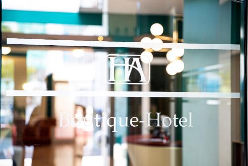 a glass door with a boutique hotel sign on it at Boutique-Hotel Amalienhof in Weimar