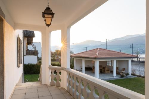 a view from the balcony of a house at Verena's Boutique Villa au lac in Sachseln