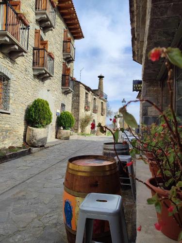 a barrel sitting on the side of a street at Hotel Rural LAbadia de Sieste in Sieste