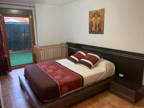 Postel nebo postele na pokoji v ubytování Apartamento con jardín privado y acceso a piscina