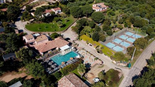 an aerial view of a house with a swimming pool at Résidence U Pirellu in Porto-Vecchio