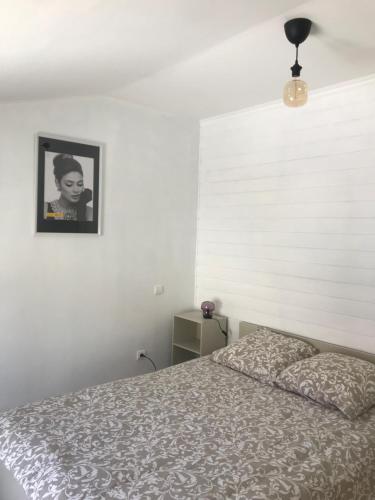Ein Bett oder Betten in einem Zimmer der Unterkunft Chez le Paul