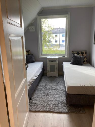 Postel nebo postele na pokoji v ubytování Bulls Haven Villa Kristiansand