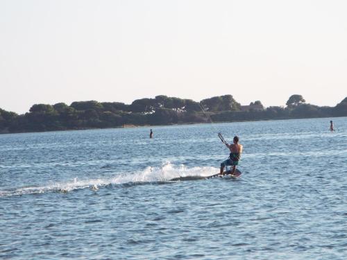 a man water skiing on a body of water at Borgo della Luna in Birgi Vecchi