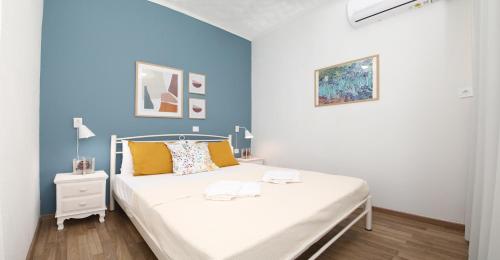 En eller flere senge i et værelse på Summer House Fotini