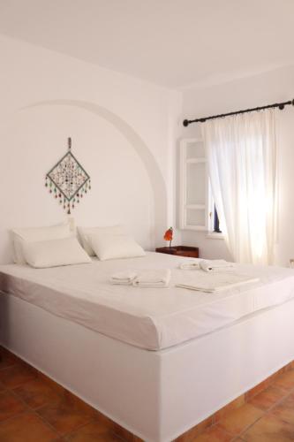 מיטה או מיטות בחדר ב-Niriedes Villas