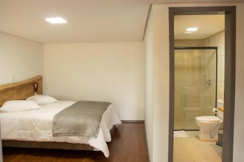 מיטה או מיטות בחדר ב-Refúgio Fortal