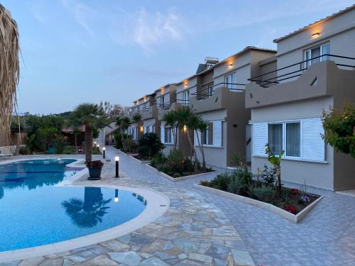 an image of a villa with a swimming pool at Secret Garden Hotel in Maleme