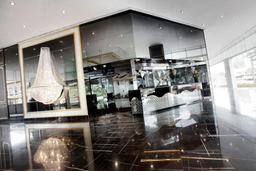 a store with a large window and a chandelier at Dorsett Singapore - Newly Refurbished in Singapore