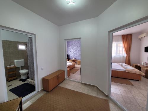 Ένα ή περισσότερα κρεβάτια σε δωμάτιο στο Vila Sophia