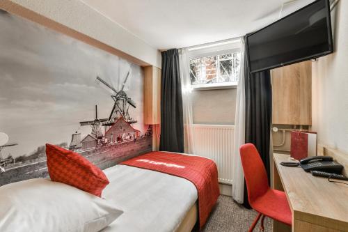 Ένα ή περισσότερα κρεβάτια σε δωμάτιο στο Prinsenhotel