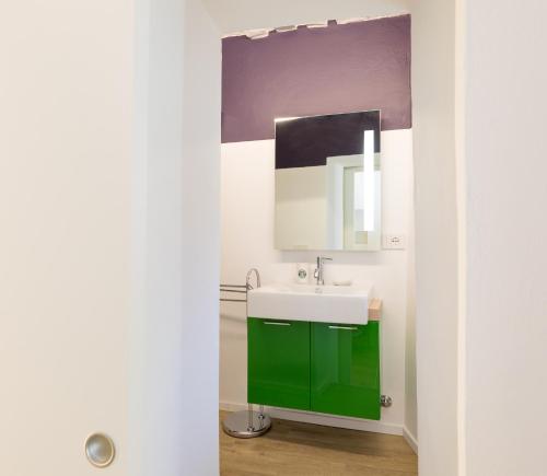 a bathroom with a sink and a mirror at Dimora Casina dell'abbondanza in Gubbio
