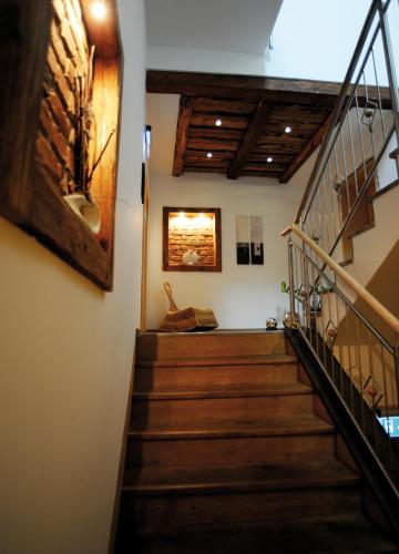 a staircase in a house with a painting on the wall at Gasthof-Pension Boxleitenmühle in Waldkirchen