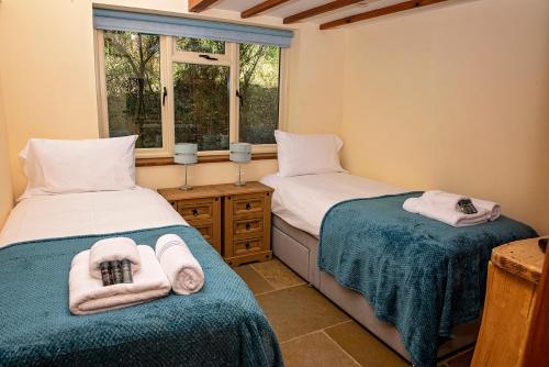 מיטה או מיטות בחדר ב-Loxleys Lodge