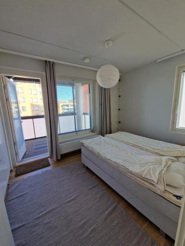 En eller flere senge i et værelse på Kalevan loisto - 40m2 Scandinavian apartment in Tampere