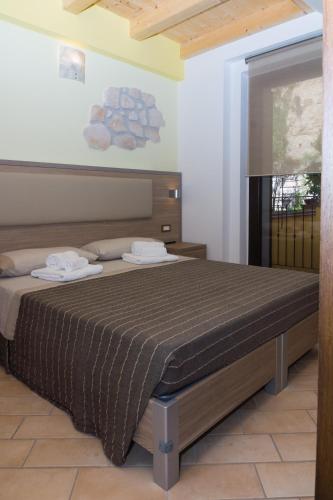 a bedroom with a bed in a room at La Piana Affittacamere in Camerano