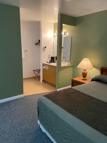 a hotel room with a bed and a bathroom at Murphey's Motel LLC in Lee Vining