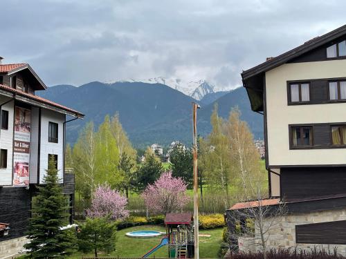 a view of a mountain range from a house at Pirin Dream View Apartments in Razlog